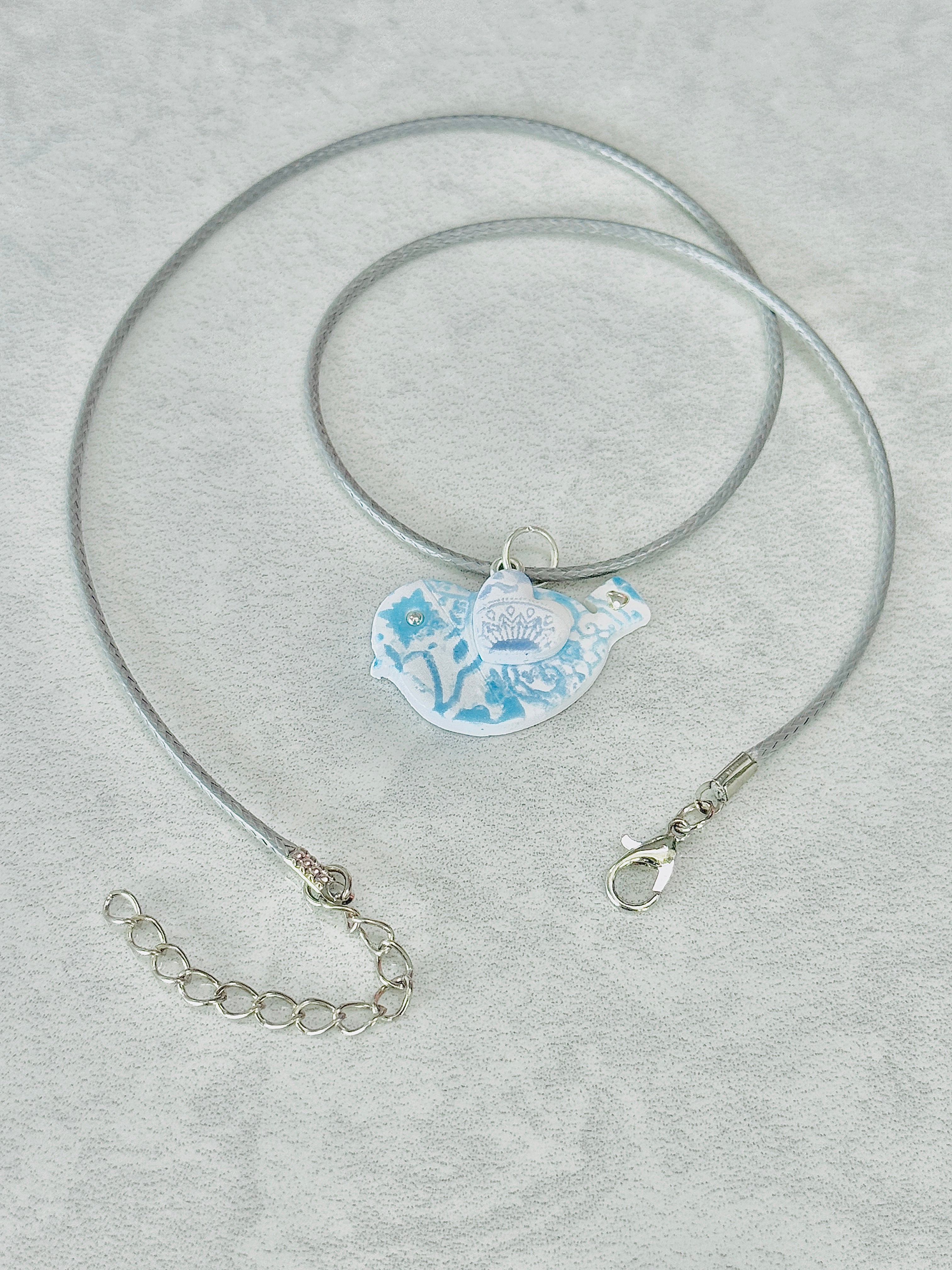 A038. Gilded breeze necklace (winter bird)